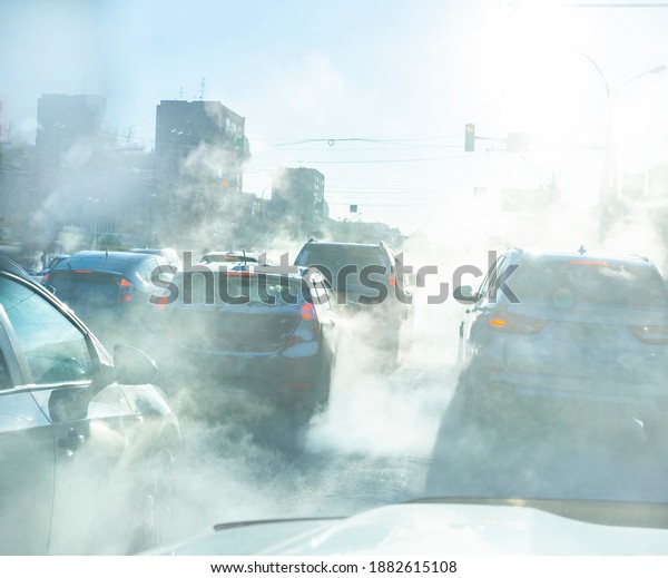 air pollution from\
the exhaust of cars in the city during the cold day, environmental\
pollution in the city
