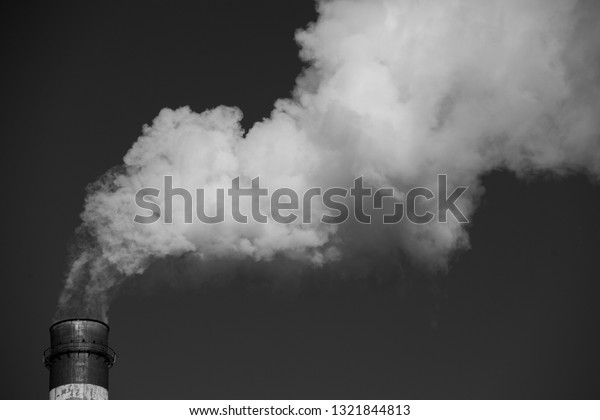 Air\
pollution. Harmful emissions. Bad ecology. Smoke from factory\
pipe\
Dirty smoke on the sky, ecology\
problems.\
