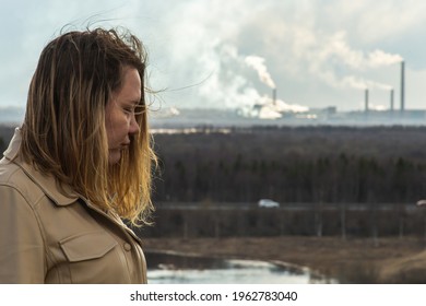 Air Pollution Pulp And Paper Mill And Sad Woman In The Foreground