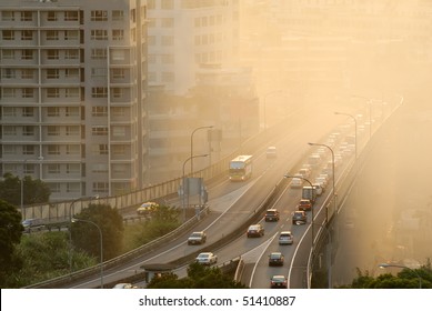 Air pollution scenic with cars on highway and yellow smoke in city.