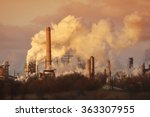 Air pollution from smoke stacks at oil refinery