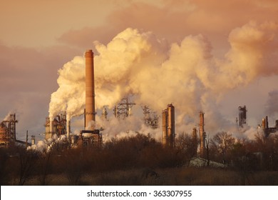 Air Pollution From Smoke Stacks At Oil Refinery