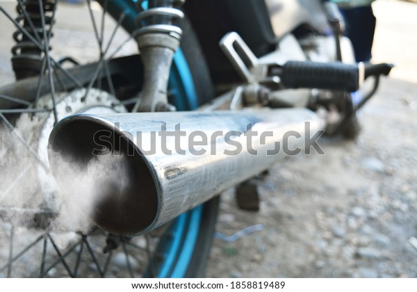 Air\
pollution from vehicle exhaust pipe close\
up