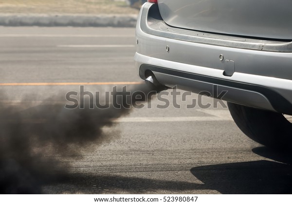 Air pollution\
from vehicle exhaust pipe on\
road