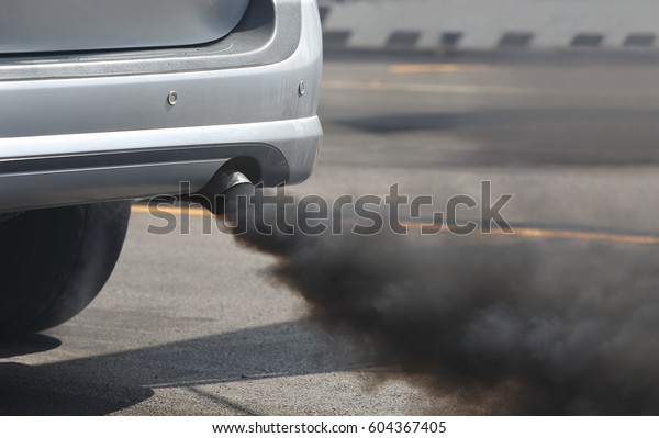 Air pollution
from vehicle exhaust pipe on
road