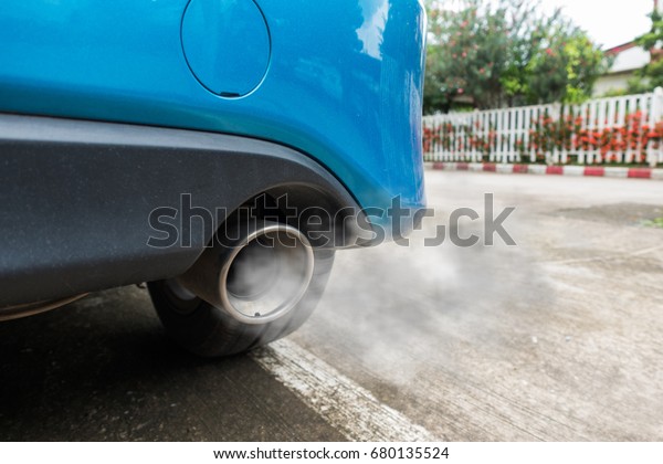 Air pollution from\
vehicle exhaust pipe