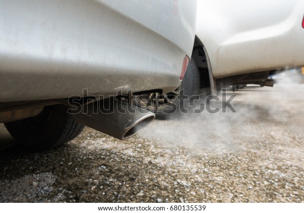 Air pollution from\
vehicle exhaust pipe