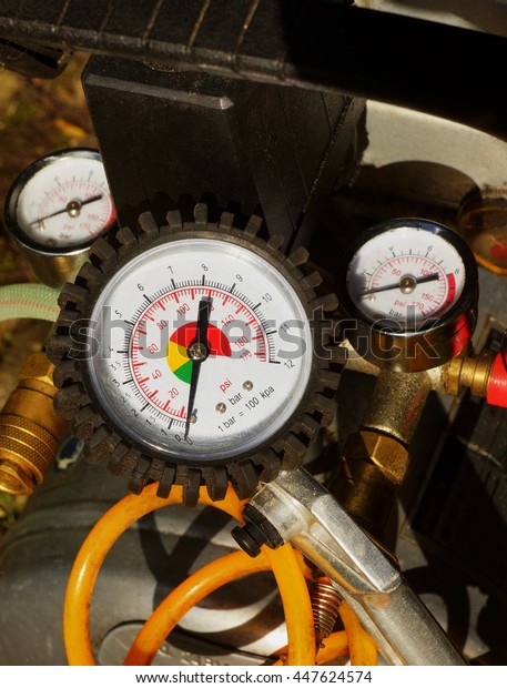 Air pressure gauge in a\
car workshop