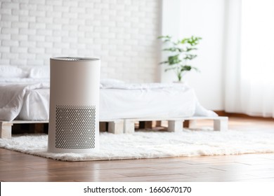 Air purifier in cozy white bed room for filter and cleaning removing dust PM2.5 HEPA in home,for fresh air and healthy life,Air Pollution Concept