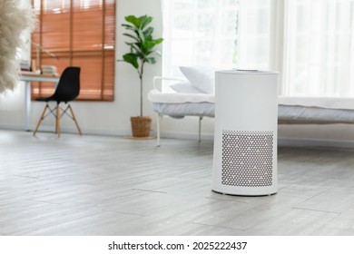 Air purifier in cozy white bedroom for filter and cleaning removing dust PM2.5 HEPA and virus in home,for fresh air and healthy Wellness life,Air Pollution Concept - Shutterstock ID 2025222437