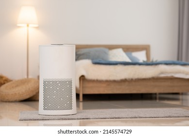 Air purifier in cozy white bedroom for filter and cleaning removing dust PM2.5 HEPA and virus in home,for fresh air and healthy Wellness life.Health care Air Pollution Concept - Shutterstock ID 2145574729