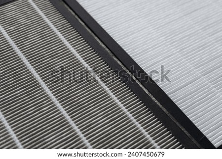 Air purifier filter (Hepa filter), Close up on air purifier filter compare between white new clean and gray dirty dust. filter for gas cleaning absorbs various gaseous pollutants such as formaldehyde.