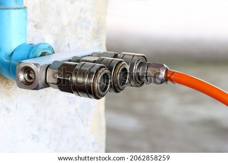 Air quick coupling, old quick coupler, air piping system in factory.
