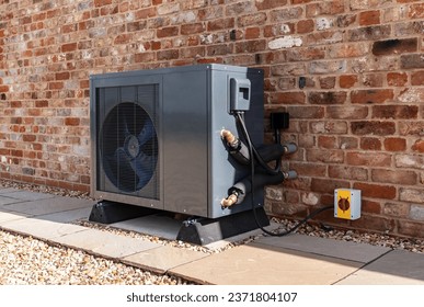 Air Source heat pump fitted outside a new home - Shutterstock ID 2371804107
