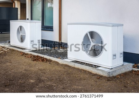 Air source heat pump installed outside of new and modern city house