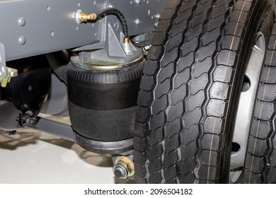 Air suspension system of a truck. Pneumatic spring on a rear axle closeup
