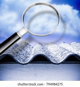 Air Testing And Monitoring Activity Around A Dangerous Asbestos Roof - Concept Image With Magnifying Glass