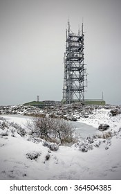 Air Traffic Control Radar Mast And Frozen Lake On The Summit Of Brown Clee Hill, The Highest Point In Shropshire, England, UK.