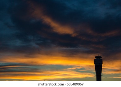 An Air Traffic Control Tower At Sunset