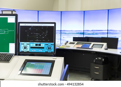 An Air Traffic Controller Is Directing Flights During A Working Day At  Control Center Room. Computer Monitors. No People.