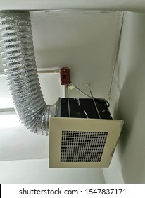 Air vent and flexible dryer hose in garbage room.