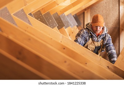 Air Vent Heating And Cooling Distribution Canal Installation By Caucasian Construction Contractor In His 40s. Home Attic Air Shafts.