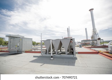 Air vents on the roof of building in functional and operational condition.