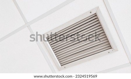air vents, symbolizing the circulation of fresh air and the importance of ventilation for a healthy and comfortable environment. The metallic grates represent the interconnectedness of spaces