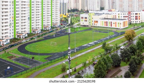 Air View Empty Soccer Football Field Near Urban School Building