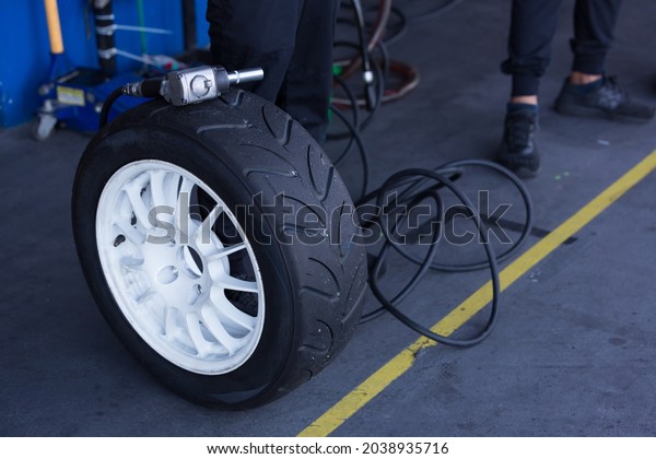 Air wrench and Tire waiting to get into action \
replacement tire.