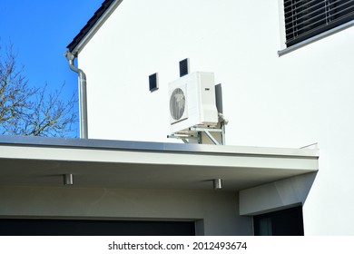 Air-Air Heat Pump For Heating And Hot Water In Front Of An Residential Building