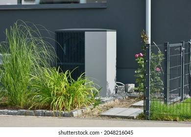 Air-Air Heat Pump For Heating And Hot Water In Front Of An New Built Residential Building