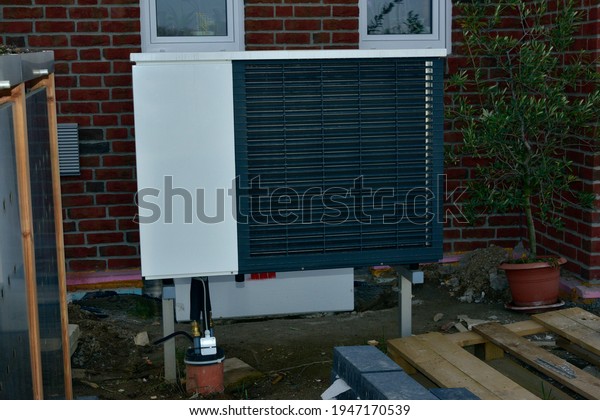 Air-Air Heat Pump for Heating and hot Water in\
Front of an Residential\
Building