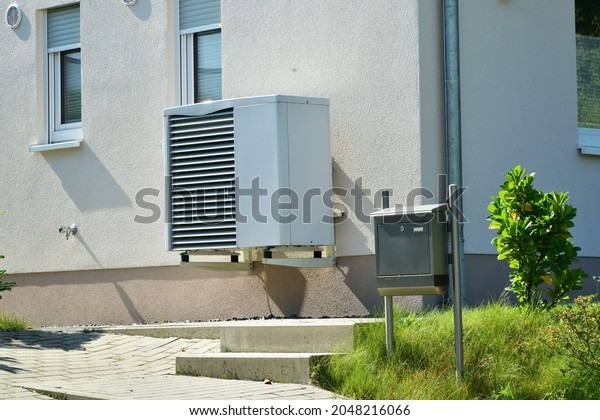 Air-Air Heat Pump for Heating and
hot Water in Front of an new built Residential
Building