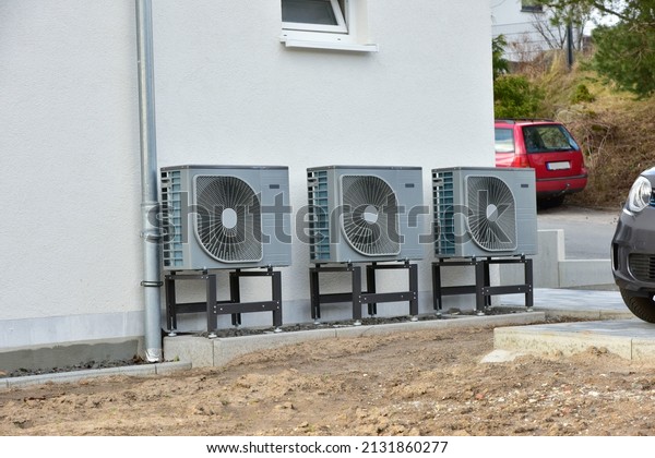 Air-Air Heat PumpAir conditioner for Heating and\
hot Water, Carport and Garbage Collection System in Front of an\
Residential Building