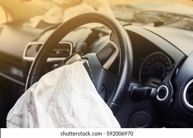 Airbag exploded at a car accident,Car Crash air bag and illumination - Shutterstock ID 592006970