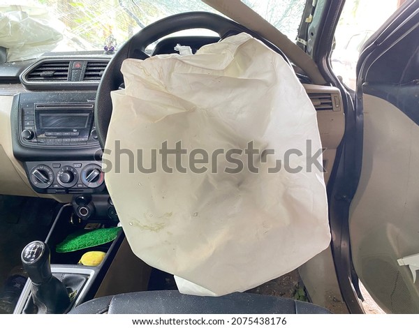 Airbag exploded at a car accident,Car
Crash and air bag came out for passengers
safety.