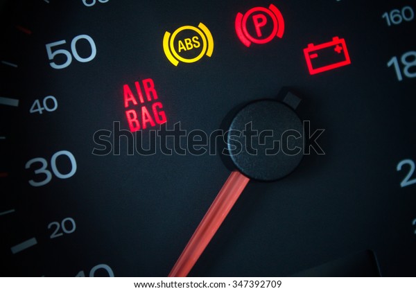 Airbag warning\
light. Car dashboard in\
closeup