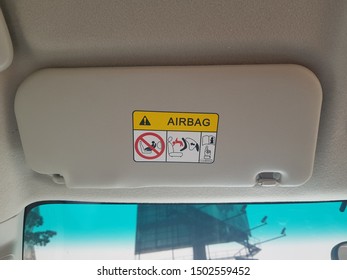 Airbag Warning Signage On Car Sun Visor.