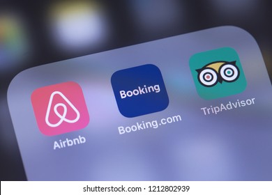 Airbnb, Booking and TripAdvisor apps icon on the screen. Services for booking rooms, enabling people to lease or rent short-term lodging, customer reviews and rating. Moscow, Russia - October 26, 2018