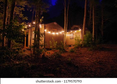 Airbnb Tiny House Cabin Exterior With Christmas Lights In The Blue Ridge Mountains.