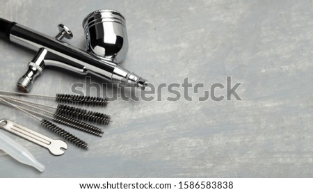Airbrush cleaning. Brushes and other airbrush cleaning tools. Copy space for text