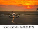 An airbus A320 at sunset at Vancouver International Airport
