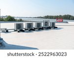 Airco with heat pump, Air compressor on rooftop building, Air conditioning installed on the roof of a tall building,Air conditioning, heat pump,