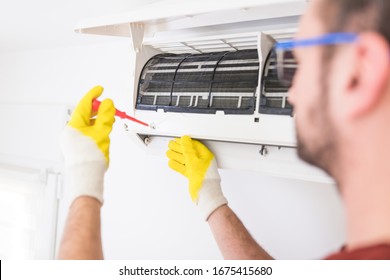Aircondition Service And Maintenance, Fixing AC Unit And Cleaning The Filters.