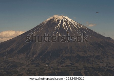 Aircraft from the 374th Airlift Wing (AW) fly by Mount Fuji, Japan, during the 374th AW Generation Exercise