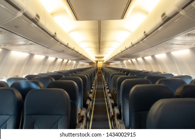 Aircraft with blue seats and windows in cabin