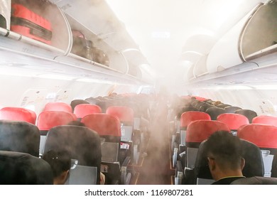 Aircraft Cabin With Smoke-like Air Vapor Condensation Due To Differences Of Temperature Between Cabin And Outside.