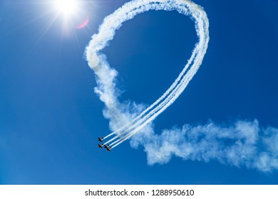 aircraft doing a loop in open sky.