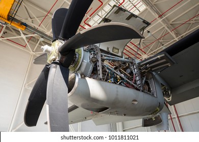 Aircraft Engine Maintenance. Airplane Engine With Propeller Gets A Repair. Military Jet.